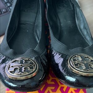 Tory Burch Shiny Black Flats with Gold Logo